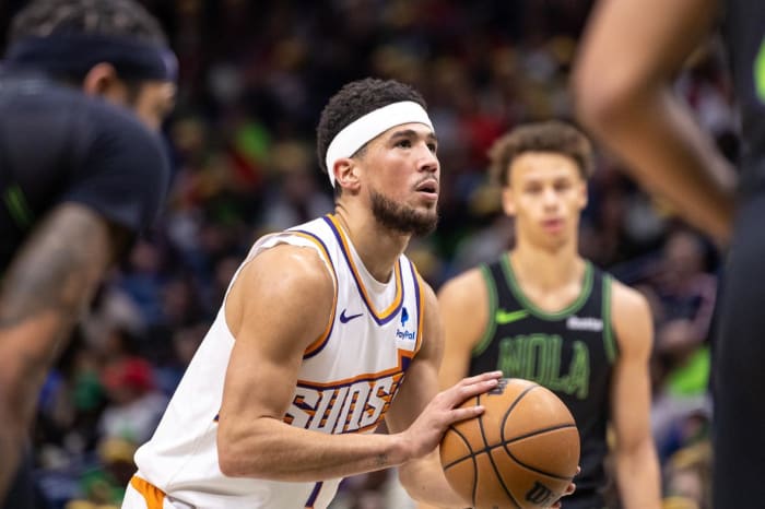Phoenix Suns guard Devin Booker (1) shoots a free throw against the New Orleans Pelicans during the first half at Smoothie King Center.